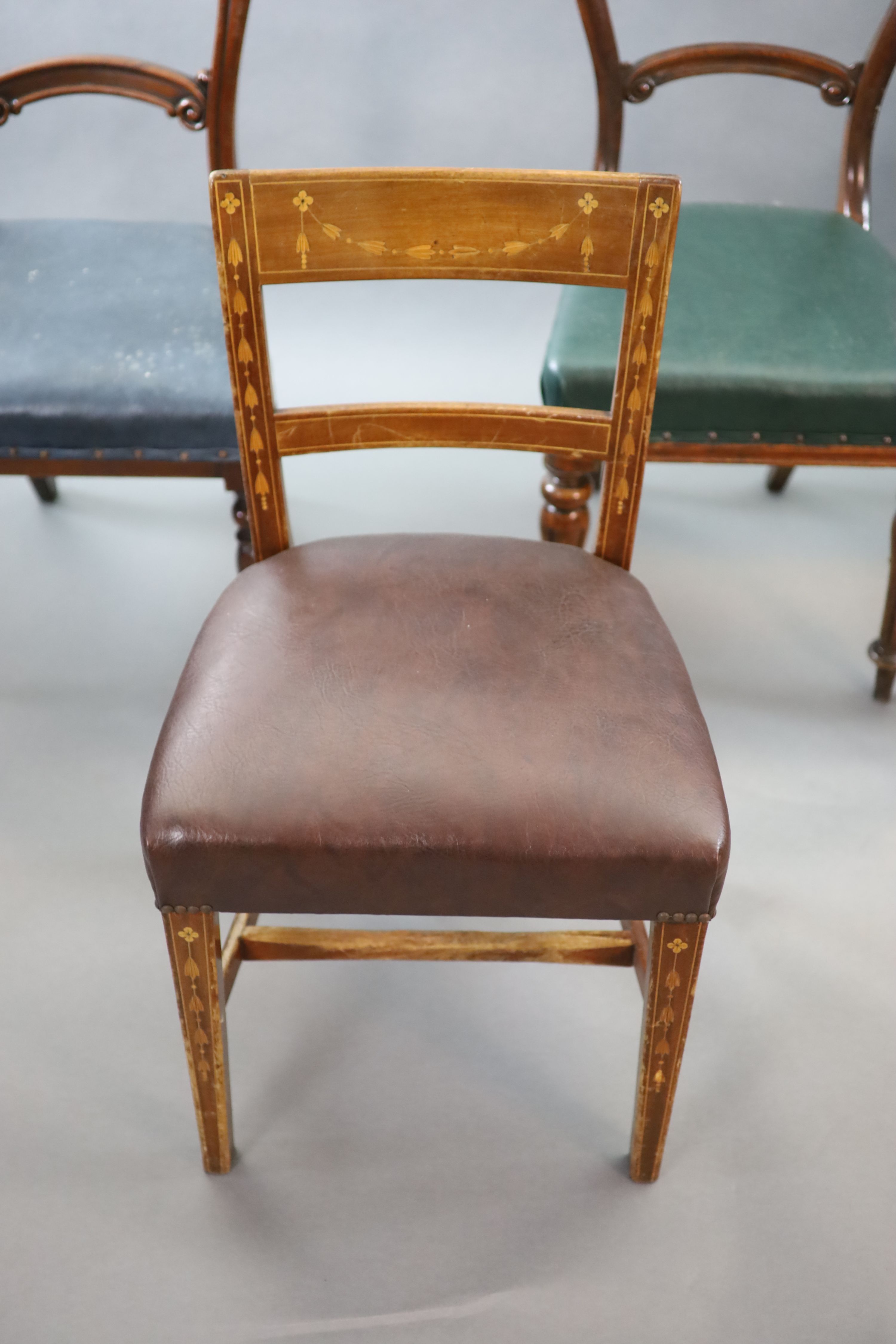 Six chairs from the Libary of the Royal College of Surgeons, including two Victorian balloon back, a marquetry inlaid Edwardian example and a 1940's green leatherette example